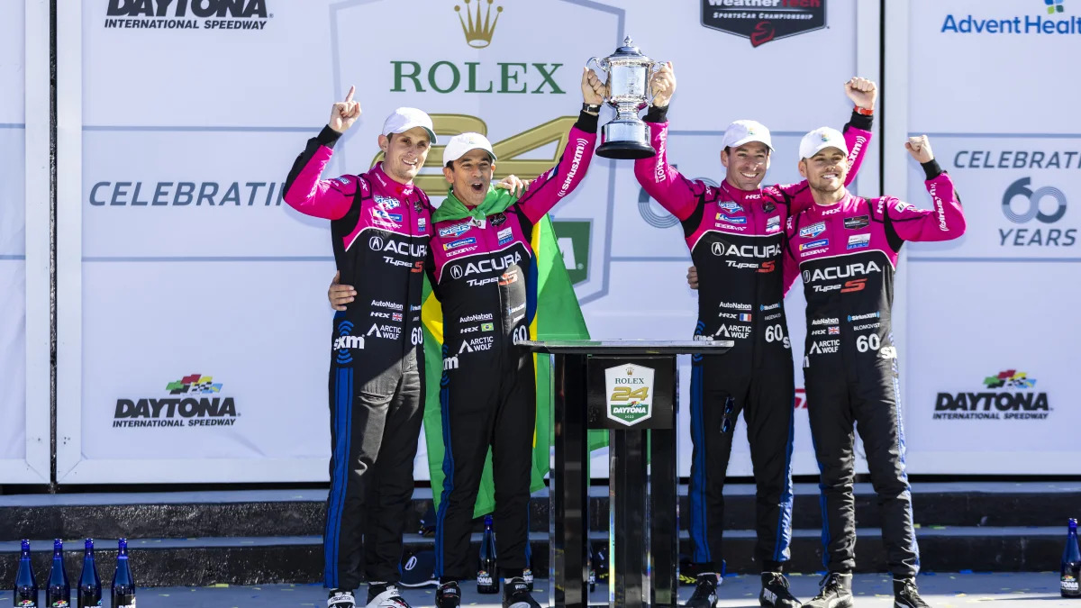 DAYTONA BEACH, FLORIDA - JANUARY 30: The #60 Meyer Shank Racing w/ Curb-Agajanian Acura DPi of Helio Castroneves, Oliver Jarvis, Tom Blomqvist, and Simon Pagenaud pose for a photo in victory lane after winning the Rolex 24 at Daytona International Speedway on January 30, 2022 in Daytona Beach, Florida. (Photo by James Gilbert/Getty Images)