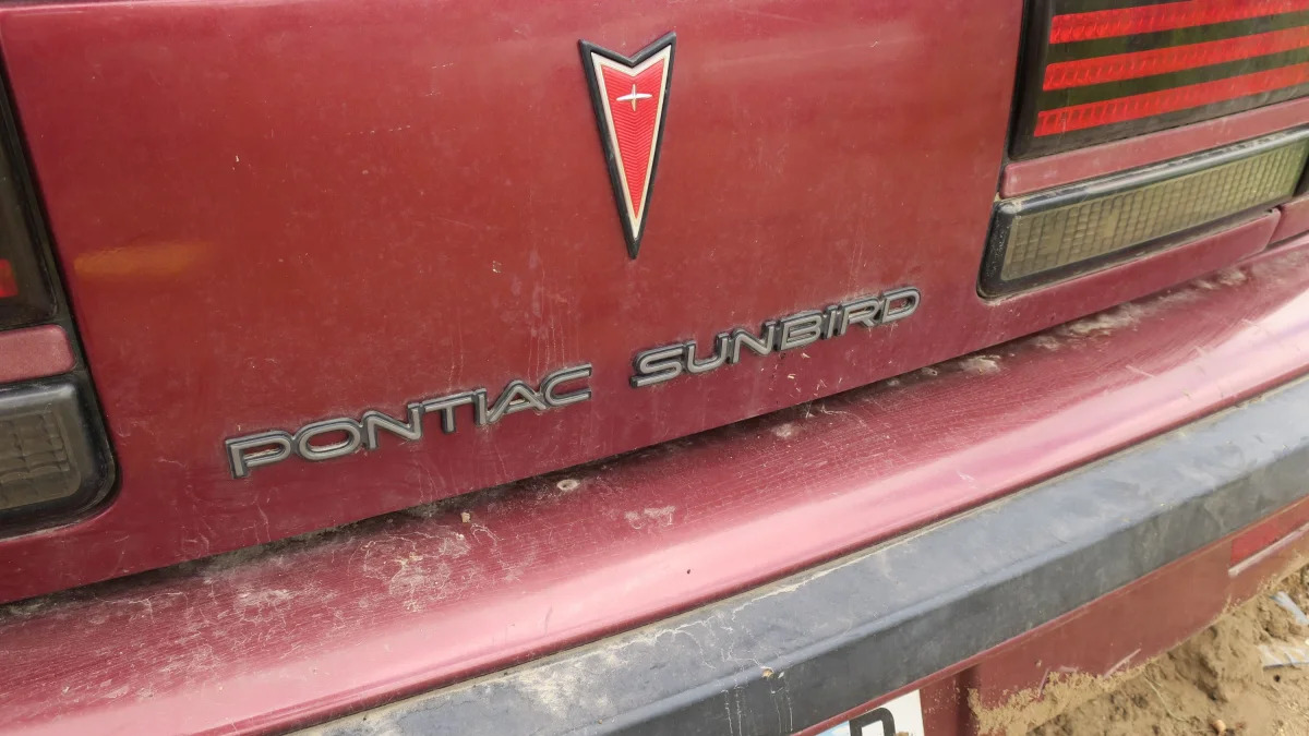 55 - 1989 Pontiac Sunbird in Minnesota junkyard - Photo by Murilee Martin