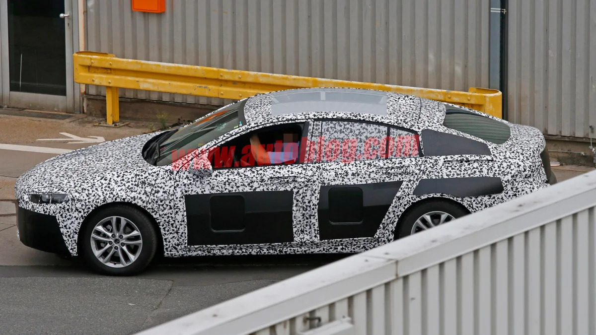 spied fence wall opel insignia camo hatchback