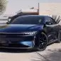 Lucid Air Sapphire front three quarter and modern house