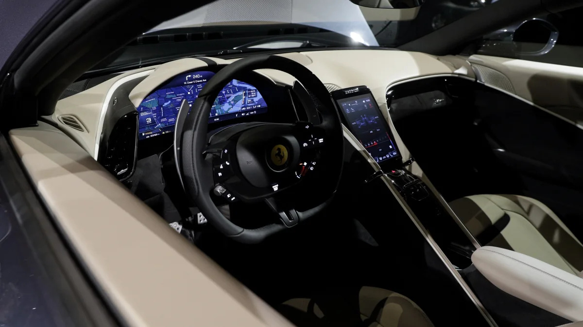A view of the cockpit of the Ferrari Roma that was unveiled in Rome, Thursday, Nov. 14, 2019. Ferrari unveils a new sports coupe aimed at enticing entry-level buyers and competing with the Porsche 911, part of a complete refresh of its model lineup by 2022. (AP Photo/Gregorio Borgia)