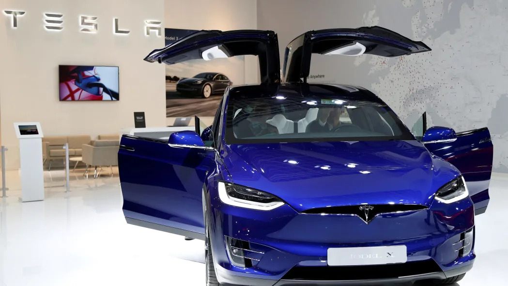A Tesla Model X with its doors open.