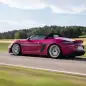 2024 Porsche 718 Spyder RS in Ruby Star Neo action rear profile roof up