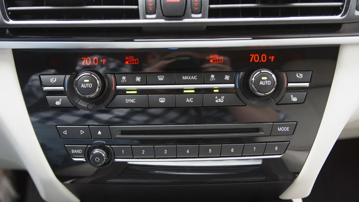 2016 BMW X5 xDrive40e climate and audio controls