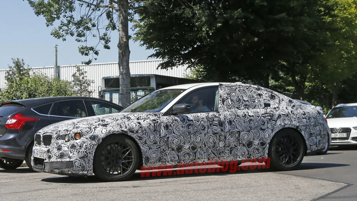 camouflaged bmw m5 spy shots wheels and brakes