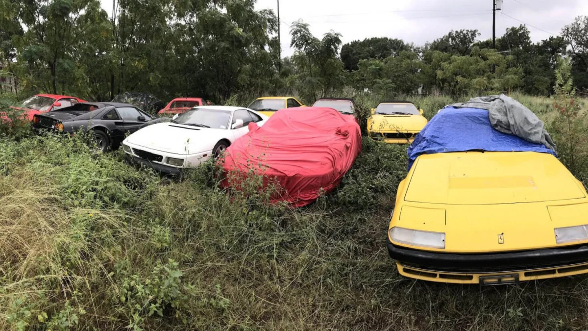 Abandoned Ferraris in field