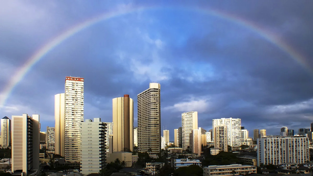 USA, Hawaii, Honolulu, Rainbow over city skyline