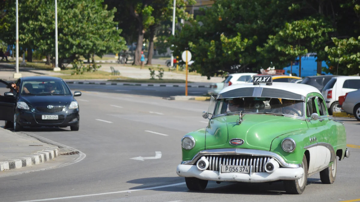 classic car taxi green havana cuba 