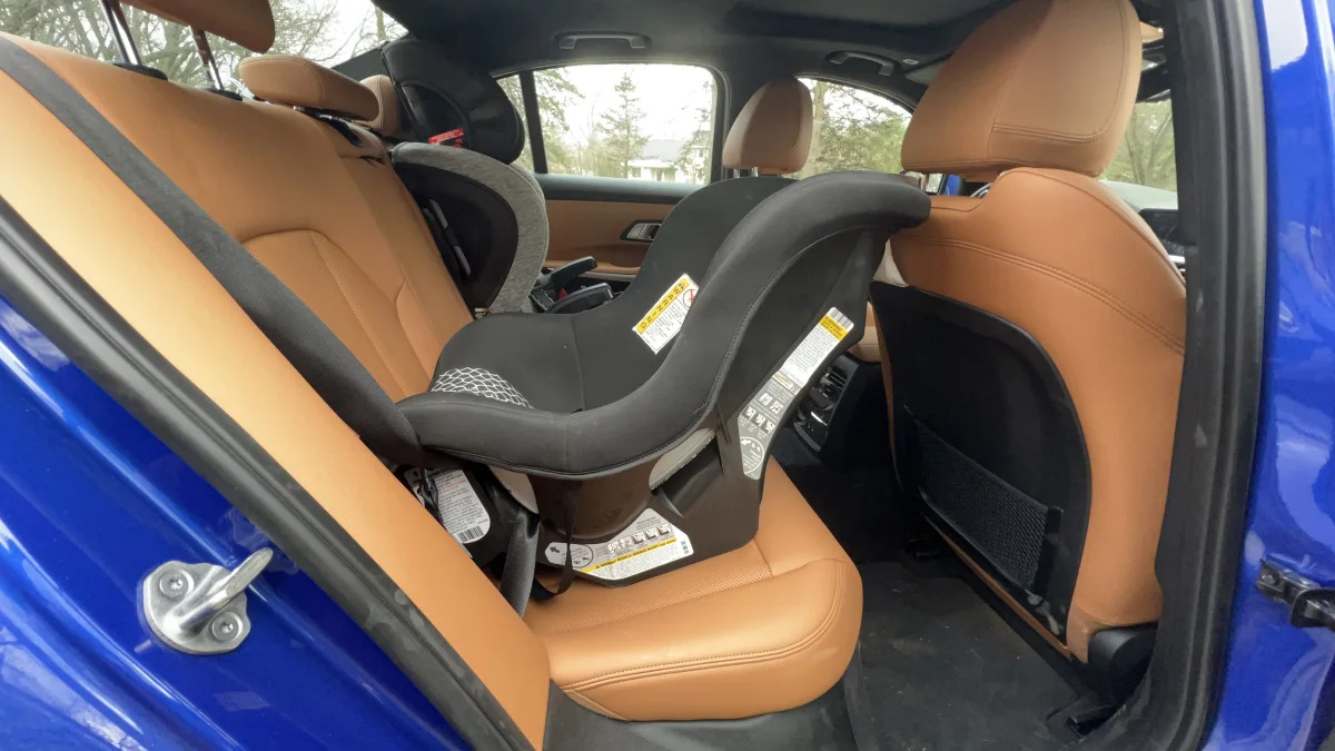 2022 BMW 330e with rear-facing seat behind passenger