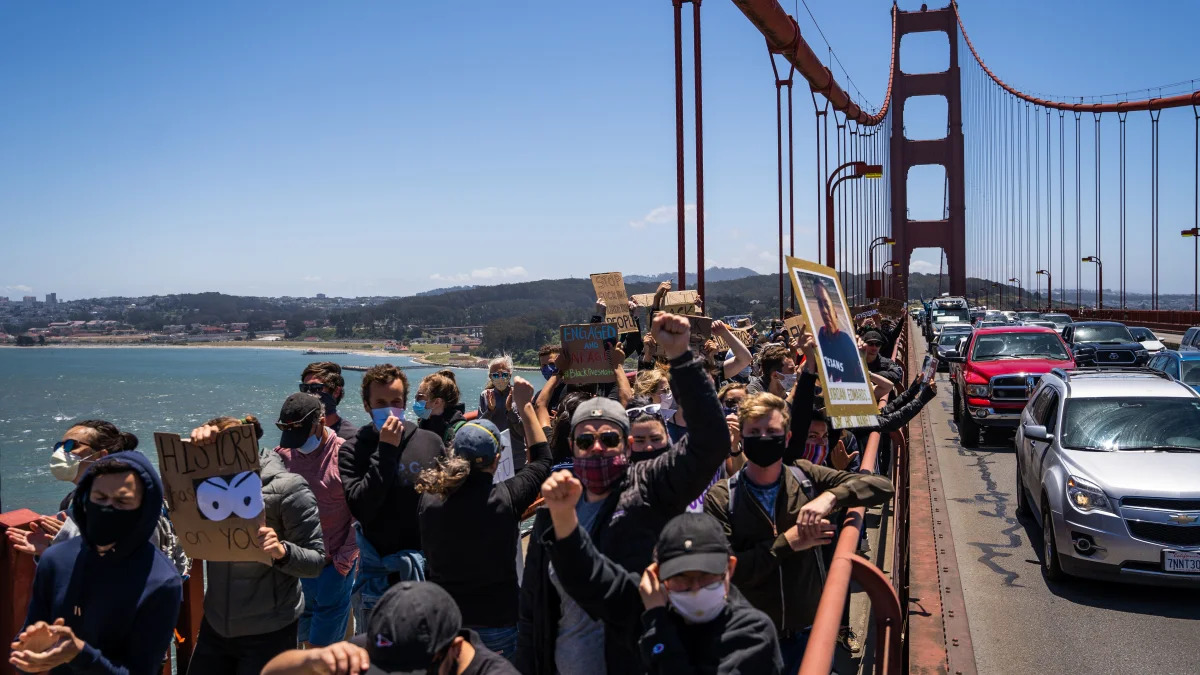 Protesters march across the Golden Gate Bridge during a demonstration against racism and police brutality in San Francisco, California, on June 6, 2020. - Demonstrations are being held across the US following the death of George Floyd on May 25, 2020, while being arrested in Minneapolis, Minnesota. (Photo by Vivian LIN / AFP) (Photo by VIVIAN LIN/AFP via Getty Images)