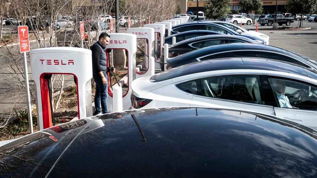 Tesla cars charge at a Supercharger station on Culver Ave. in Irvine, CA on Friday, January 28, 2022. An advisory group in the state legislature is developing recommendations for reusing or recycling electric vehicle batteries