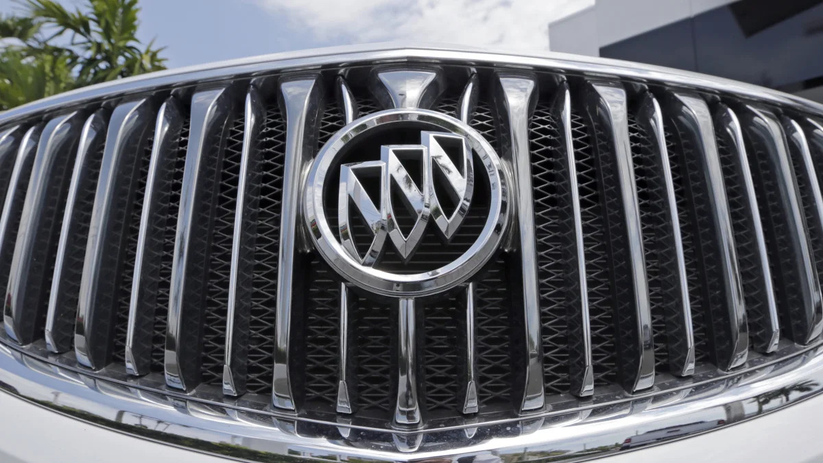 In this photo taken Wednesday, April 26, 2017, shows the front grille of a 2017 Buick Enclave at a GMC Buick dealership in Miami. (AP Photo/Alan Diaz)