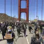 Dozens of people march across the Golden Gate Bridge in support of the Black Lives Matter movement in San Francisco Saturday, June 6, 2020. People are protesting the death of George Floyd, who died after he was restrained by Minneapolis police on May 25 in Minnesota. (AP Photo/Jeff Chiu)