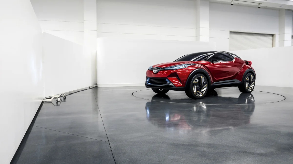 The Scion C-HR concept shown off in red for the LA Auto Show, indoor front three-quarter.