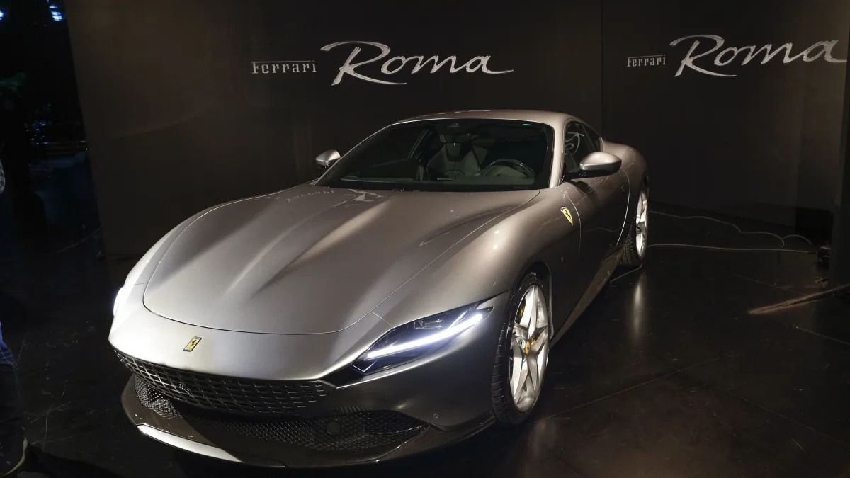 The Ferrari Roma car is unveiled in Rome, Thursday, Nov. 14, 2019. Ferrari unveils a new sports coupe aimed at enticing entry-level buyers and competing with the Porsche 911, part of a complete refresh of its model lineup by 2022. (AP Photo/Gregorio Borgia)