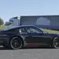 Spy shot of the next-generation 992-model Porsche 911 thought to hide a hybrid powertrain, side.