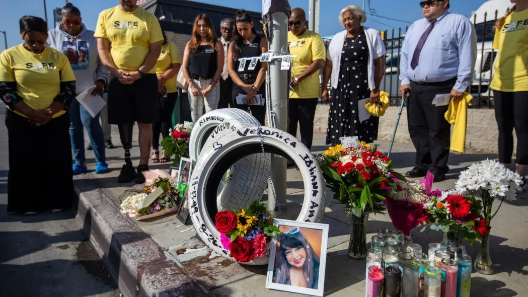 Representatives of Streets are for Everyone, a nonprofit traffic-safety advocacy group, place three white tires for a ``Ghost Tire Memorial" on Thursday, Aug. 31, 2023, near the location where three women were killed in a traffic collision while riding in an Uber in Los Angeles.