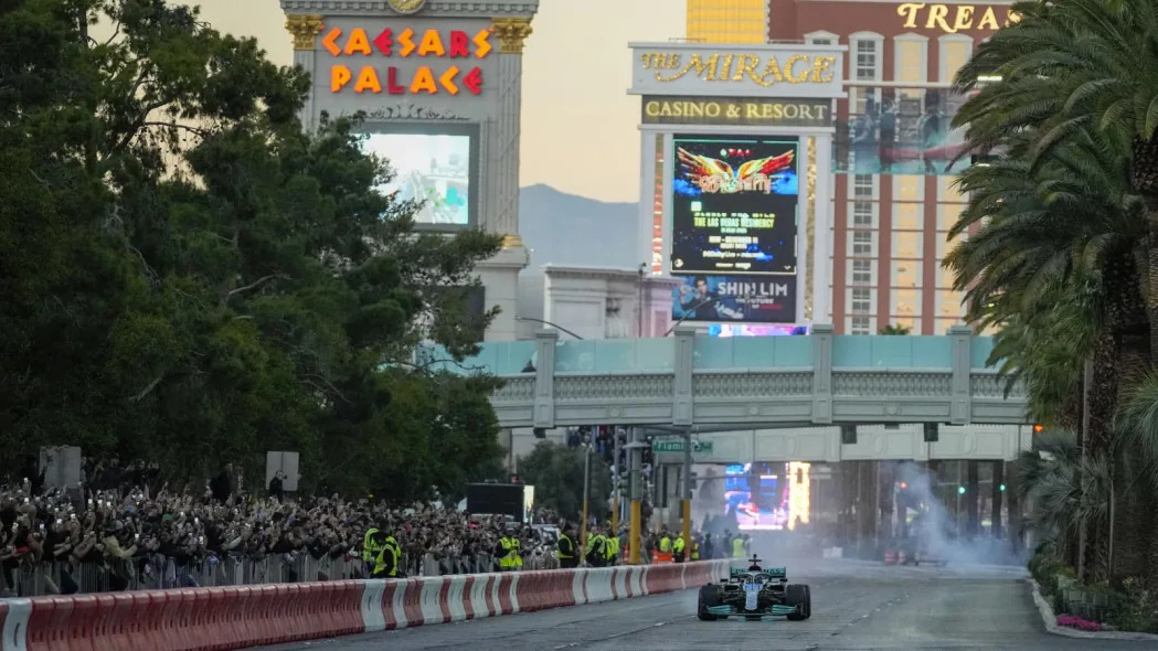 Nov 5, 2022; Las Vegas, Nevada, USA;  Mercedes-AMG Petronas driver George Russell drives on the track during the Formula One Las Vegas Grand Prix Launch Party at Las Vegas Strip. Mandatory Credit: Ray Acevedo-USA TODAY Sports