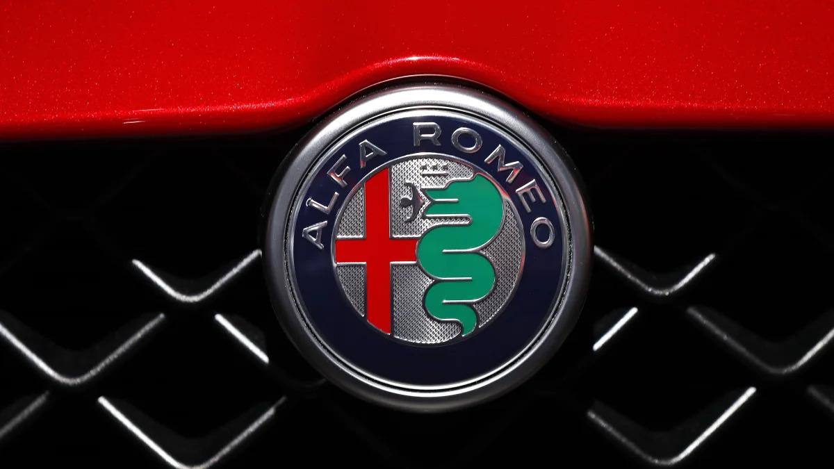 An Alfa Romeo logo is shown at the North American International Auto Show in Detroit, Monday, Jan. 14, 2019. (AP Photo/Paul Sancya)