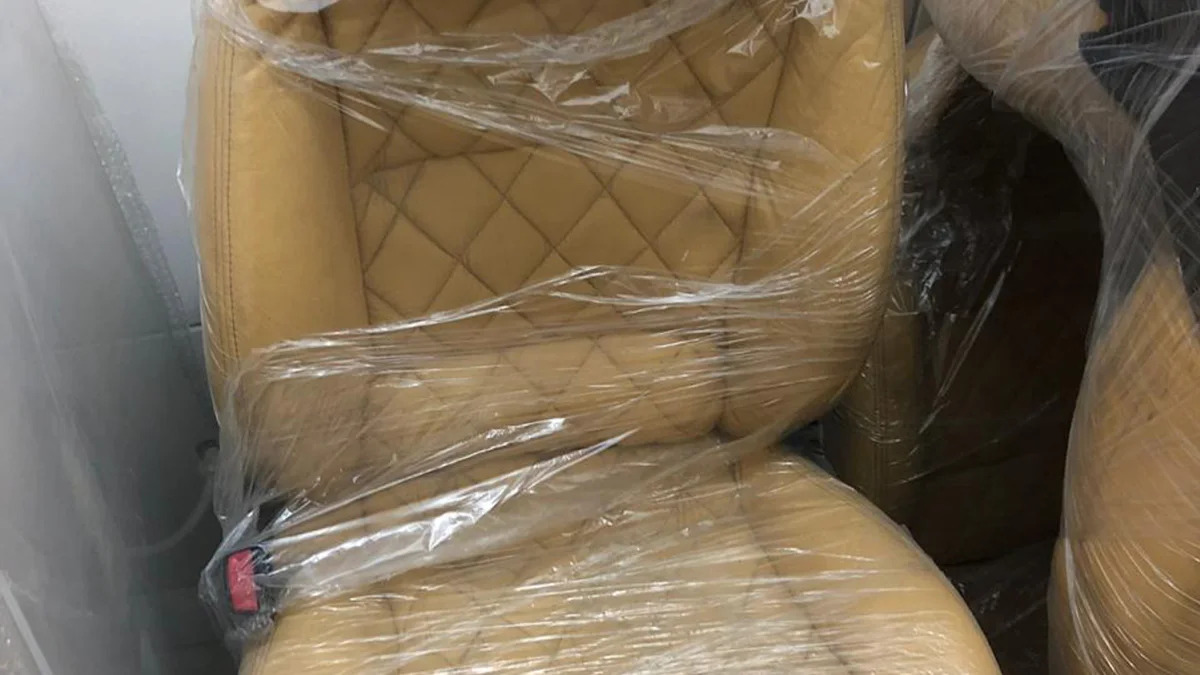 This July 15, 2019 photo released by Itajai Civil Police shows the seat of a car embroidered with a fake Lamborghini logo, inside a workshop in Itajai, Brazil. Brazilian police dismantled the clandestine workshop run by a father and son who assembled fake Ferraris and Lamborghinis to order, in Brazil's southern state of Santa Catarina. (Itajai Civil Police via AP) (Itajai Civil Police via AP)