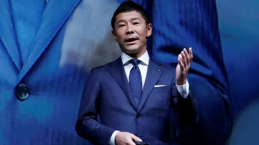 FILE PHOTO: Yusaku Maezawa, the chief executive of Zozo, which operates Japan's popular fashion shopping site Zozotown and is officially called Start Today Co, speaks at an event launching the debut of its formal apparel items, in Tokyo, Japan, July 3, 2018. REUTERS/Kim Kyung-Hoon/File Photo