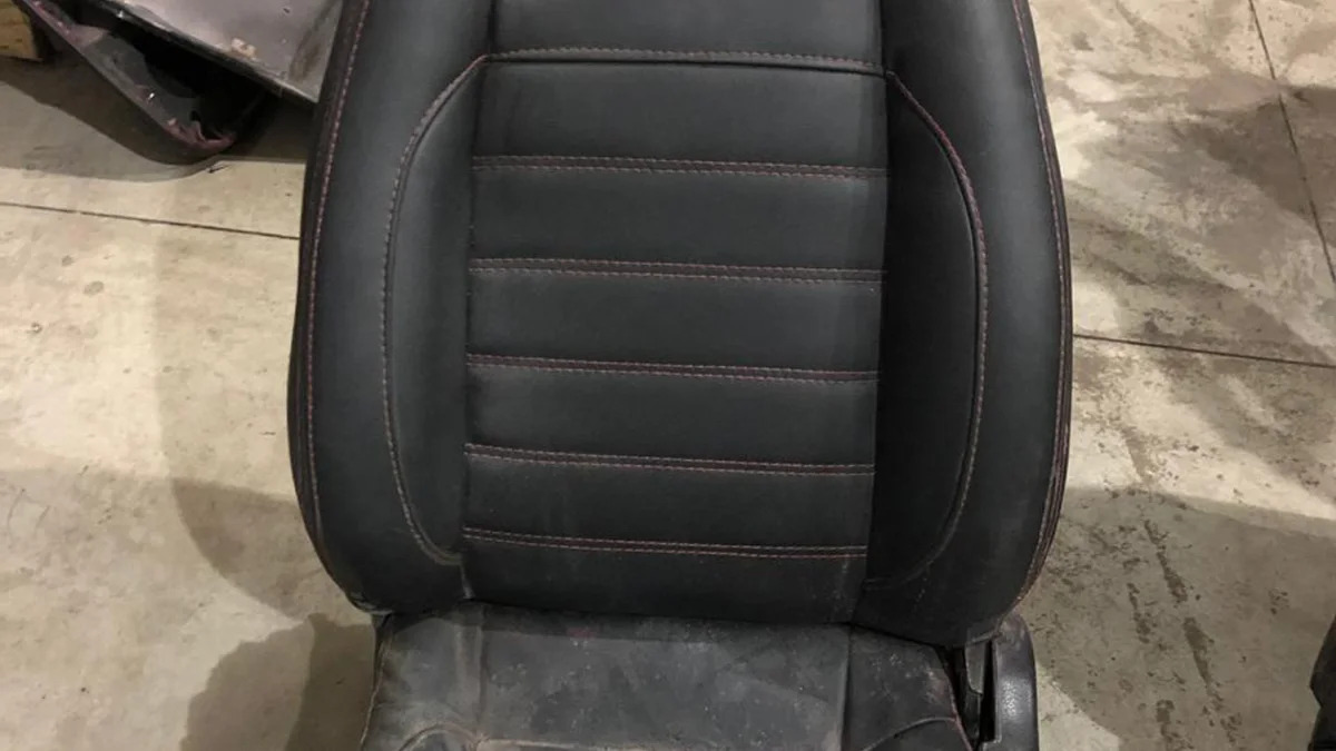 This July 15, 2019 photo released by Itajai Civil Police shows the seat of a car embroidered with a fake Ferrari logo,  inside a workshop in Itajai, Brazil. Brazilian police dismantled the clandestine workshop run by a father and son who assembled fake Ferraris and Lamborghinis to order, in Brazil's southern state of Santa Catarina. (Itajai Civil Police via AP)