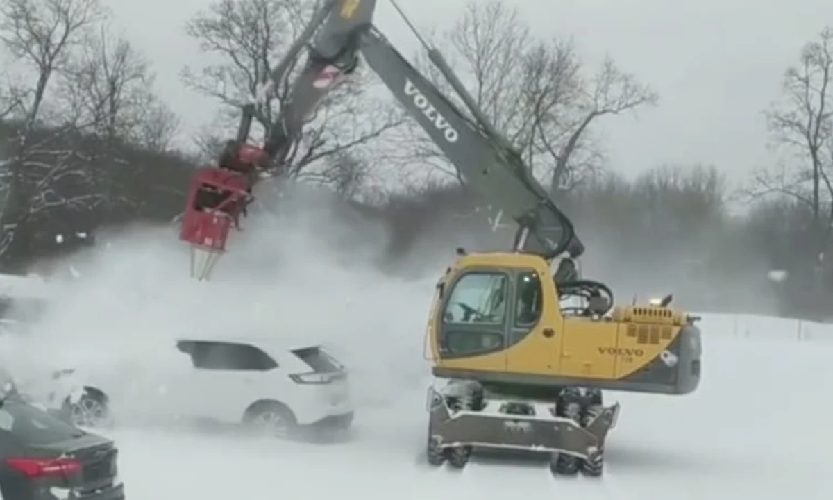 Watch a turbine-equipped Volvo excavator blast snow off cars - Autoblog
