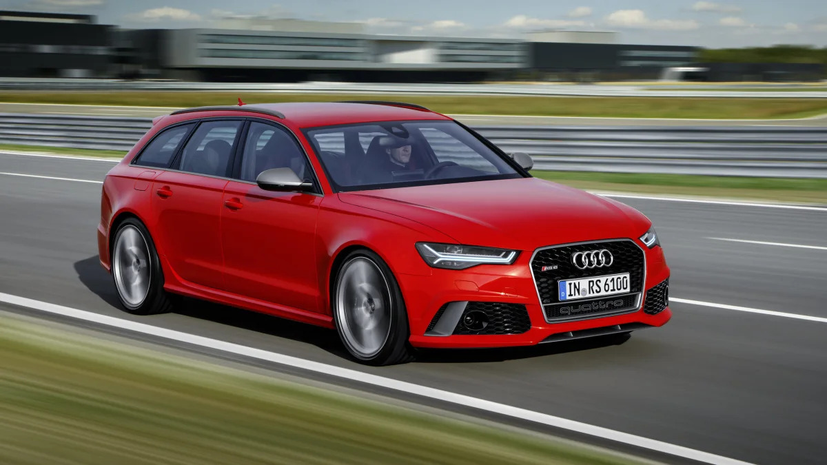 red audi rs6 avant performance front three quarters road