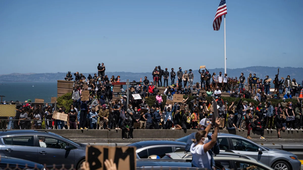 Protesters gather at the entrance to the Golden Gate Bridge during a demonstration against racism and police brutality in San Francisco, California, on June 6, 2020. - Demonstrations are being held across the US following the death of George Floyd on May 25, 2020, while being arrested in Minneapolis, Minnesota. (Photo by Vivian LIN / AFP) (Photo by VIVIAN LIN/AFP via Getty Images)