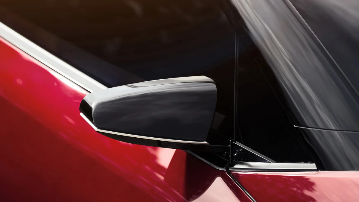 The Scion C-HR concept shown off in red for the LA Auto Show, side mirror detail.