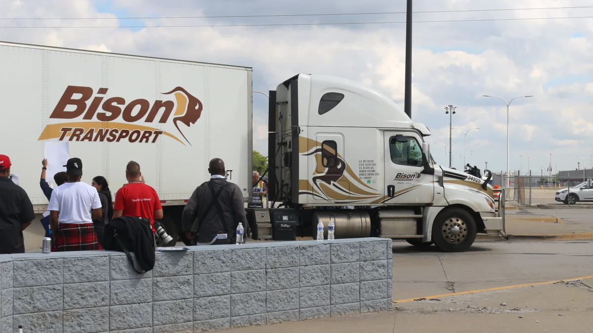 UAW Picketers block a truck attempting to enter the Michigan Assembly facility Friday.