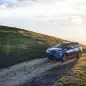 blue 2016 toyota rav4 hybrid gravel road 