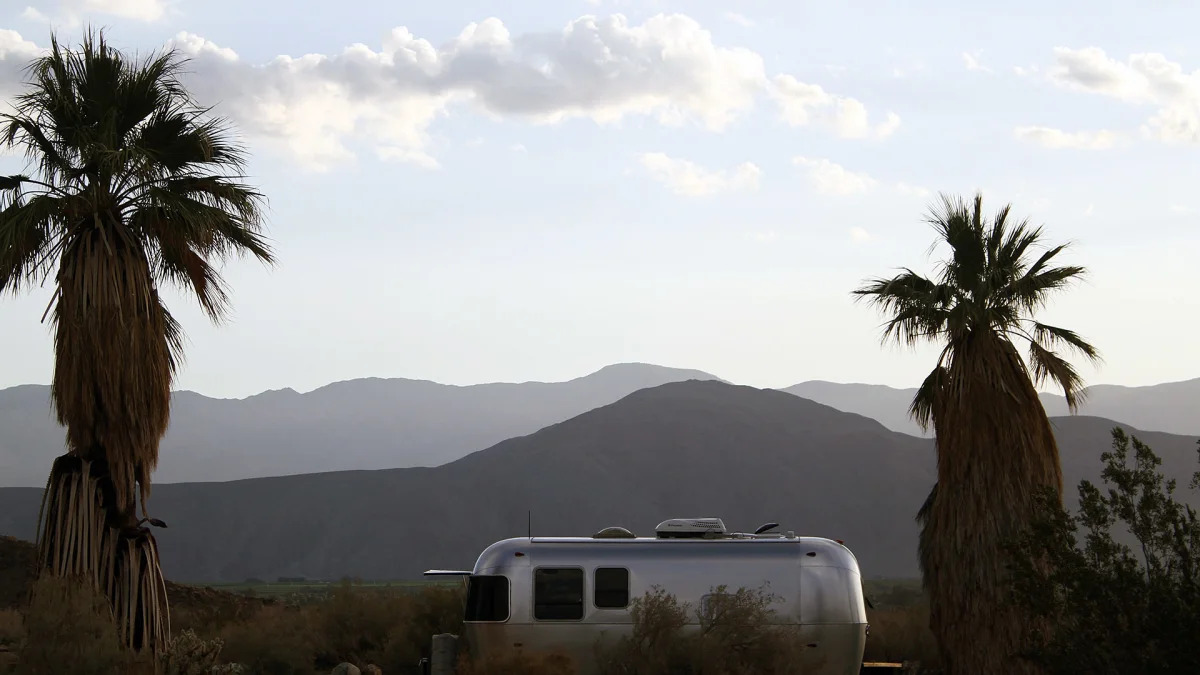 Airstream Bambi Sport 22 side mountains palm trees