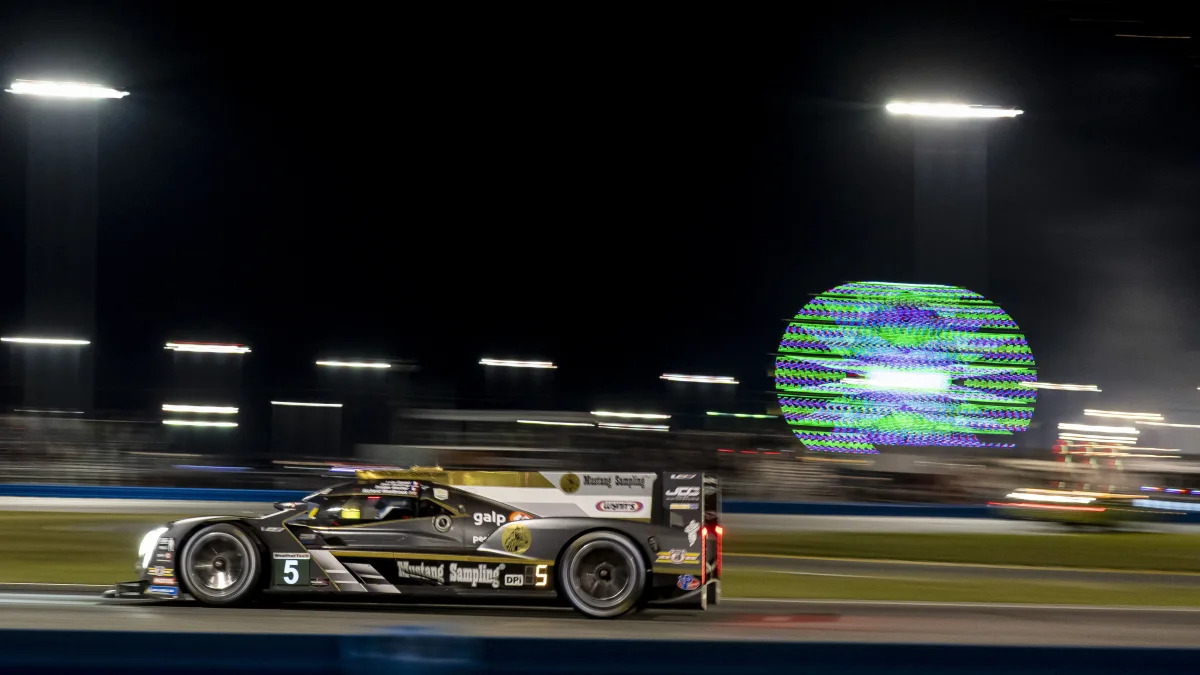 DAYTONA, FL - JANUARY 29: 
JDC Miller MotorSports driver Tristan Vautier - FRA, Richard Westbrook - GBR, Loic Duval - FRA, Ben Keating - USA (5) of Cadillac DPi drives through the east horse shoe during the Rolex 24 IMSA Race on January 29th 2022, at Daytona Speedway in Daytona, FL. (Photo by Andrew Bershaw/Icon Sportswire via Getty Images)