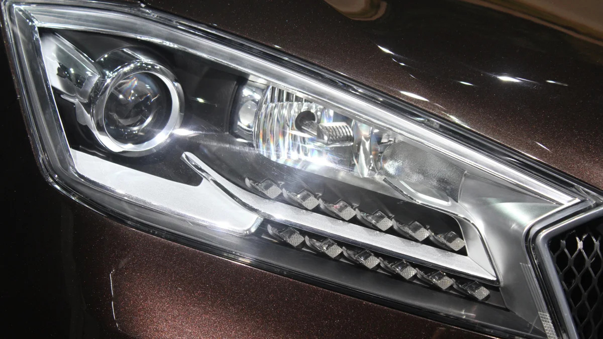 The Borgward BX7, resurrecting the Borgward brand name after 50 years, unveiled at the 2015 Frankfurt Motor Show, headlight detail.