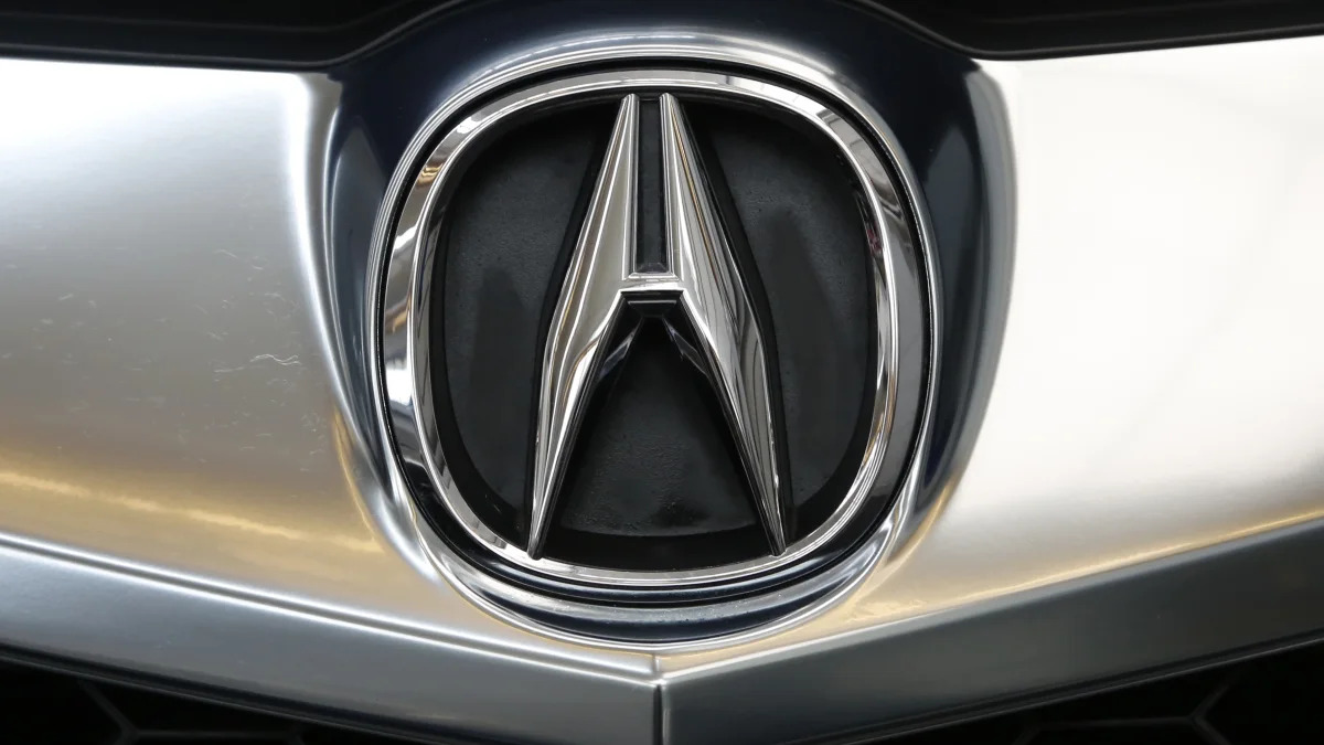 This is the Acura logo on the grill of an Acura 2018 ILX Tech Plus A-Spec model on display at the Pittsburgh Auto Show Thursday, Feb. 15, 2018. (AP Photo/Gene J. Puskar)