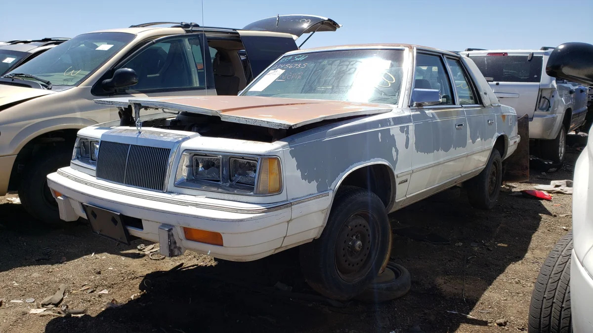 34 - 1988 Chrysler LeBaron in Colorado junkyard - photo by Murilee Martin