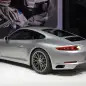 The 2016 Porsche 911 Carrera, now with a turbocharged engine in the standard car, unveiled at the Frankfurt Motor Show, rear three-quarter view.