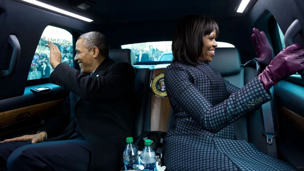 Barack and Michelle Obama ride in the presidential limousine in2013