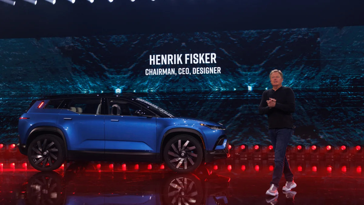 Henrik Fisker, CEO of electric-vehicle maker Fisker Inc., stands next to his company's flagship electric Ocean SUV in Huntington Beach, California, August 3, 2023.  REUTERS/Mike Blake