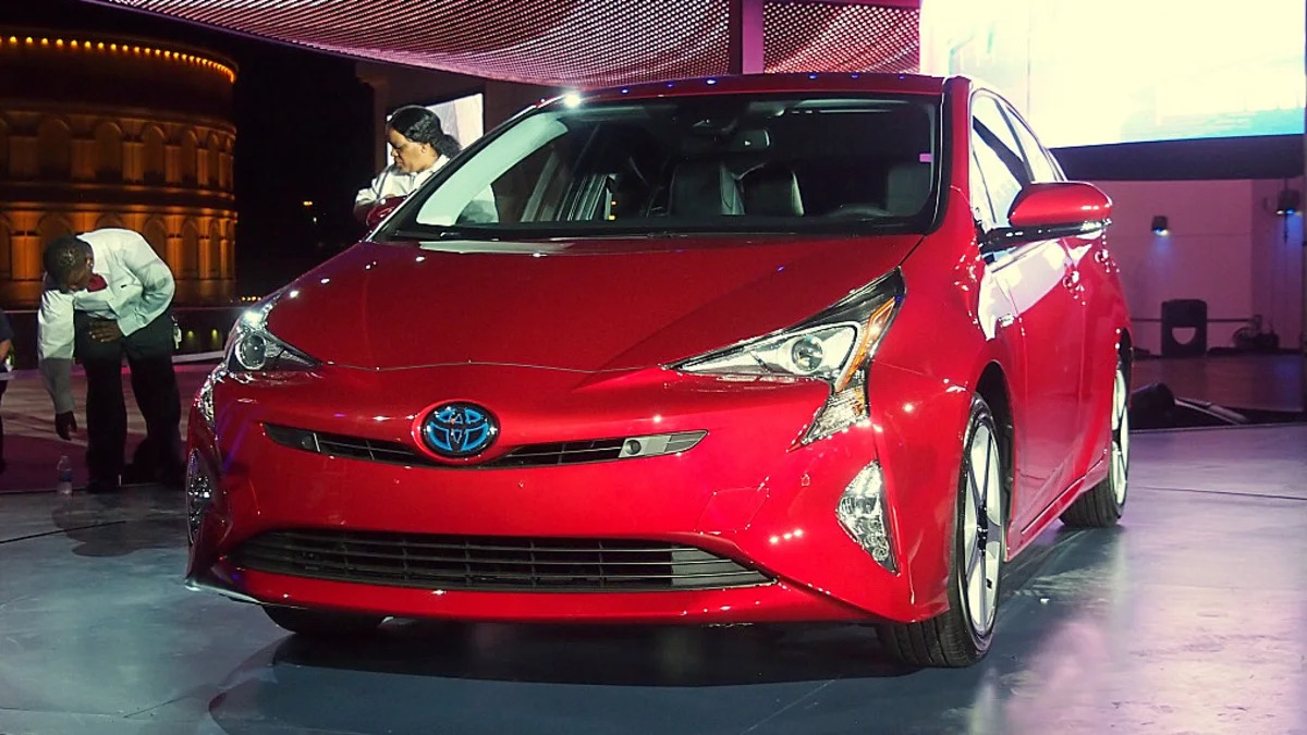 2016 Toyota Prius red, at reveal event, front 3/4