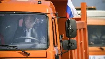 Putin drives a dump truck