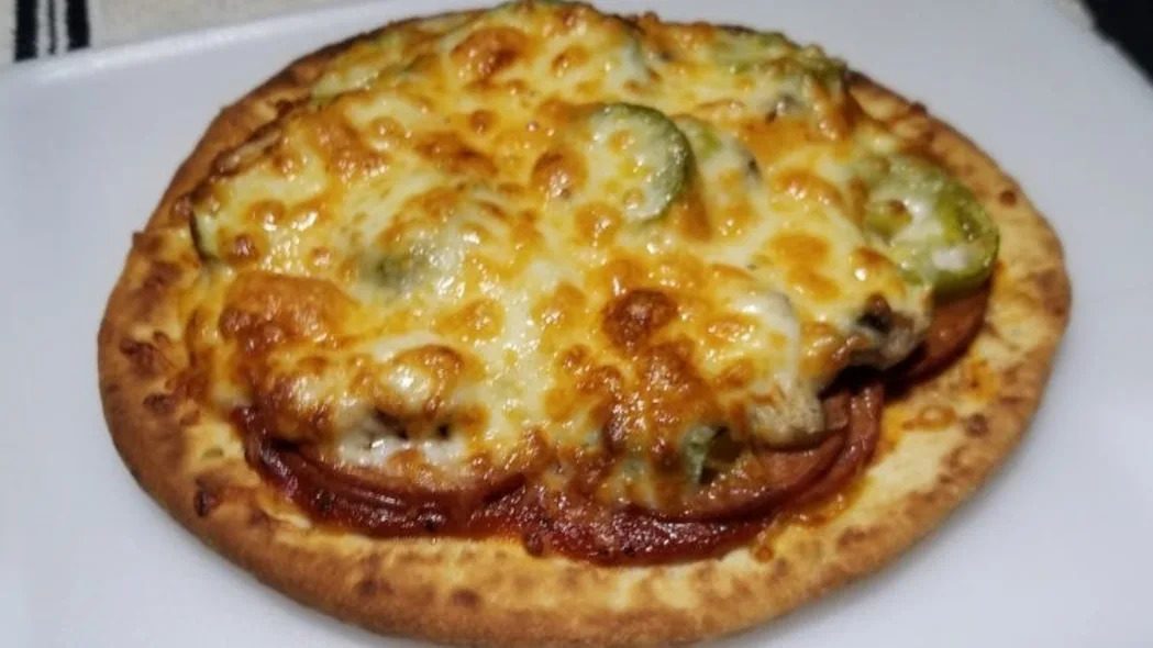 Home-made pizza on pita bread