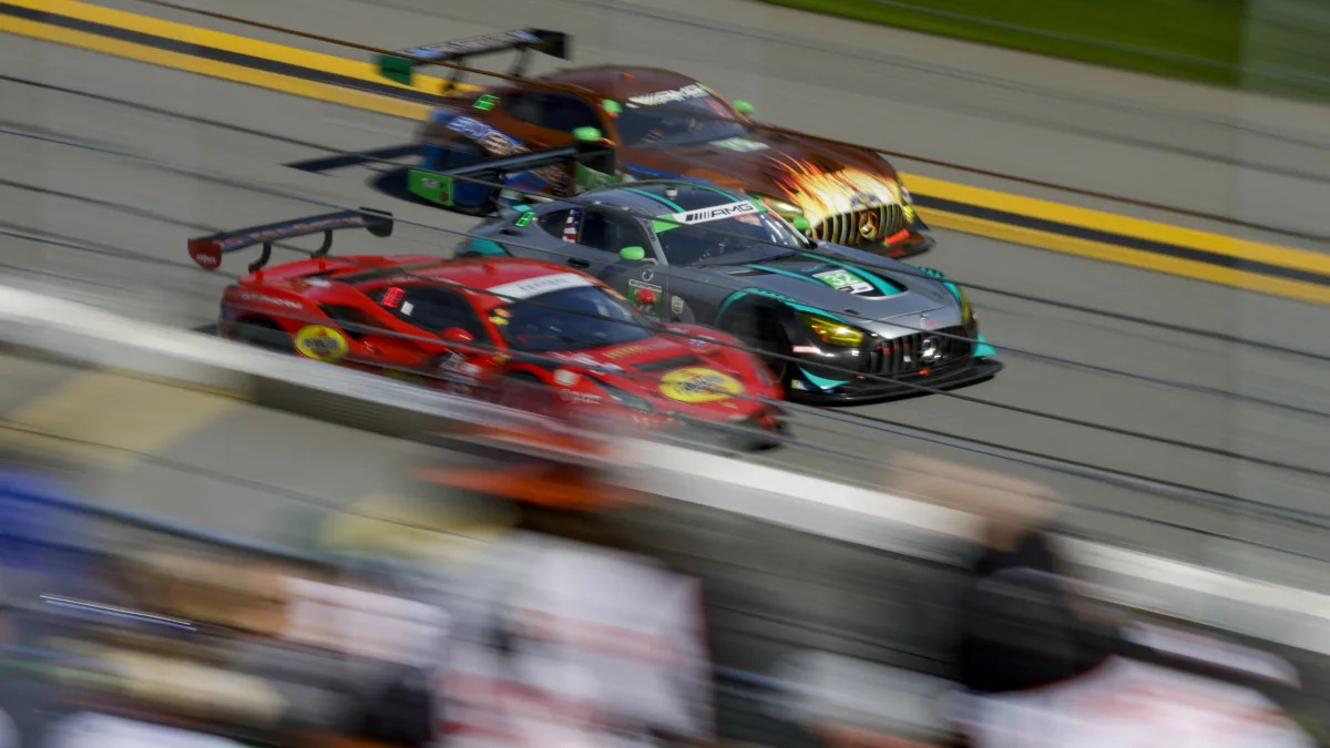 DAYTONA, FL - JANUARY 29: The #32 Gilbert Korthoff Motorsports Mercedes-AMG GT3 of Mike Skeen, Guy Cosmo, Stevan McAleer, and Scott Andrews races the #62 Risi Competizione Ferrari 488 GT3 of Alessandro Pier Guidi, James Calado, Daniel Serra, and Davide Rigon and the #75 Sun Energy 1 Mercedes-AMG GT3 of Kenny Habul, Luca Stolz, Raffaele Marciello, and Fabian Schiller  during the Rolex 24 at Daytona on January 29, 2022 at Daytona International Speedway in Daytona Beach, Fl. (Photo by David Rosenblum/Icon Sportswire via Getty Images)