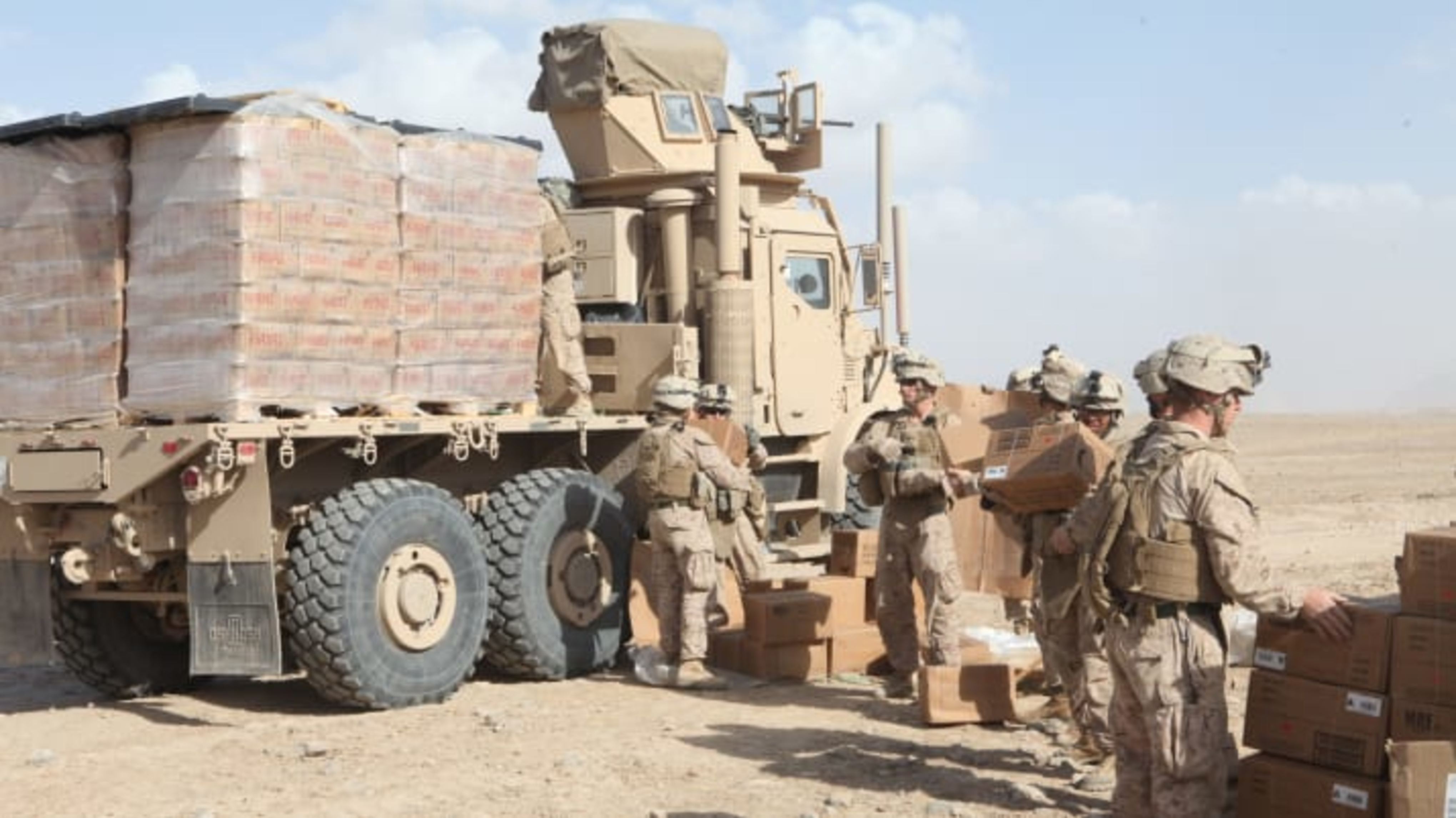 Soldiers unloading MREs and water