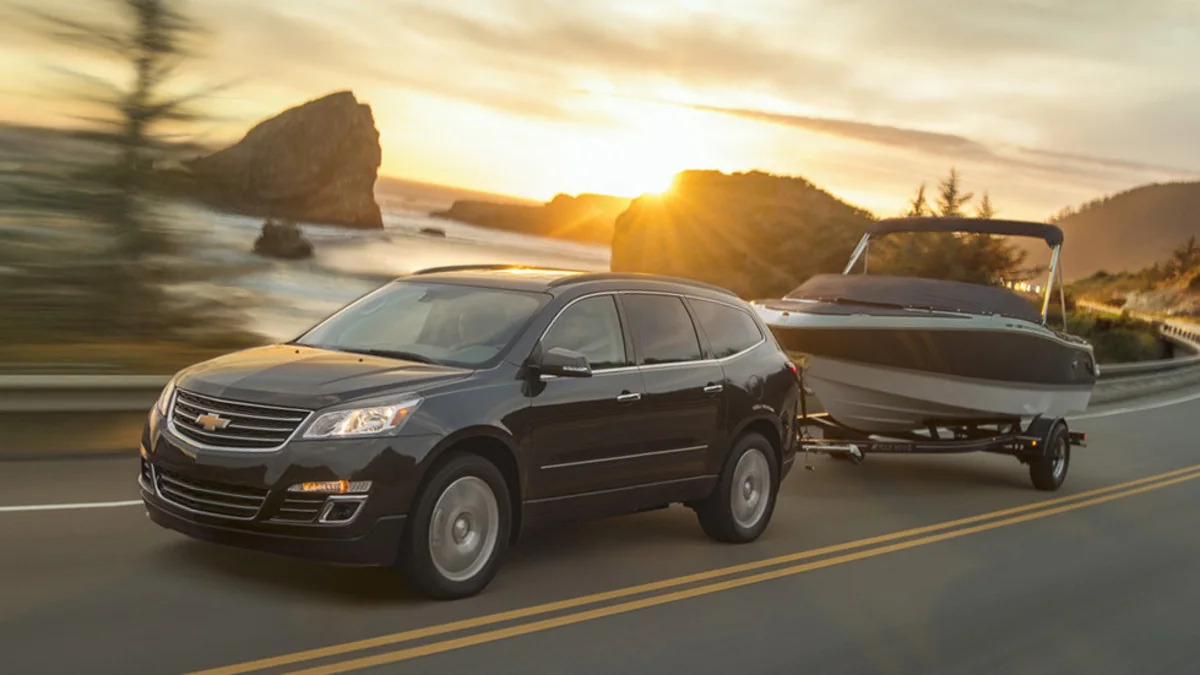 Chevy Traverse in black towing a boat