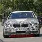 camouflaged bmw m5 spy shots front on