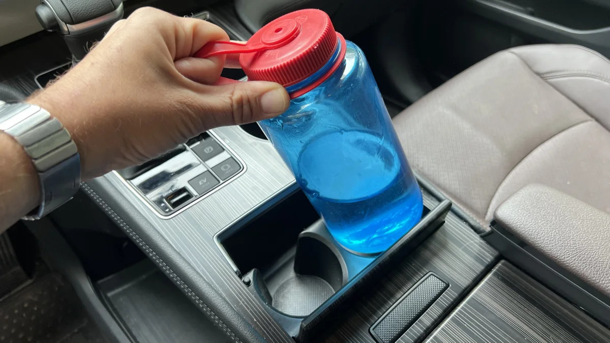 2023 Toyota Sienna - covered front cupholders with Nalgene