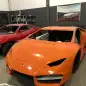 This July 15, 2019 photo released by Itajai Civil Police shows luxury car replicas inside a workshop in Itajai, Brazil. Brazilian police dismantled the clandestine workshop run by a father and son who assembled fake Ferraris and Lamborghinis to order, in Brazil's southern state of Santa Catarina. (Itajai Civil Police via AP)