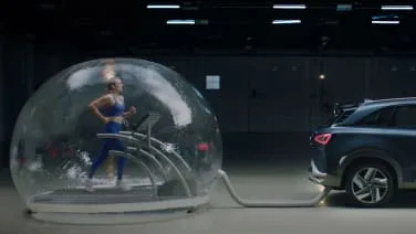 Hyundai put a runner inside a bubble of Nexo exhaust